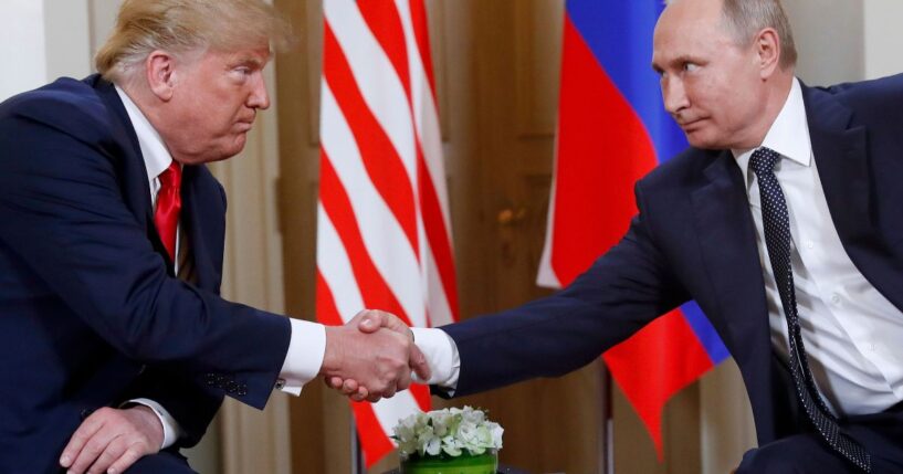 President Donald Trump, left, and Russian President Vladimir Putin, right, shake hands at the beginning of a meeting at the Presidential Palace in Helsinki, Finland, on July 16, 2018.