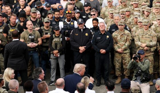 President Donald Trump, bottom center, speaks to deployed federal officers and the National Guard at the U.S. Park Police Anacostia Operations Facility in Washington, D.C., on Thursday.