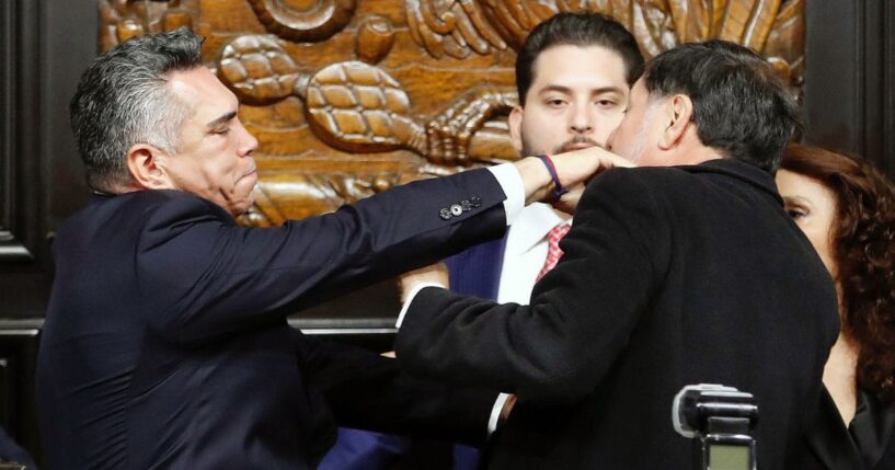 Senator Alejandro Moreno of the Institutional Revolutionary Party (PRI) throws a punch at Senator Gerardo Fernandez Norona of the National Regeneration Movement Party (Morena) during a session of the Permanent Commission of the Senate in Mexico City on Aug. 27, 2025.
