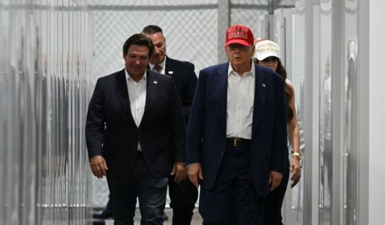 Florida Governor Ron DeSantis, President President Donald Trump, and Homeland Security Secretary Kristi Noem tour a medical facility during a visit to a migrant detention center dubbed "Alligator Alcatraz," located at the site of the Dade-Collier Training and Transition Airport in Ochopee, Florida, on July 1, 2025.