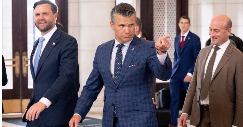 Vice President J.D. Vance, left, Defense Secretary Pete Hegseth, center, and White House Deputy Chief of Staff Stephen Miller react to protesters Wednesday as they leave after greeting members of the National Guard stationed at Union Station in Washington, D.C.