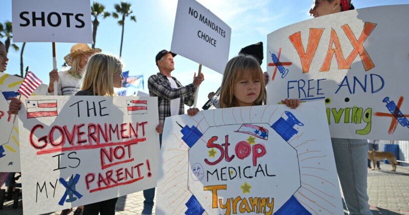 People demonstrate against COVID vaccine mandates for students in Huntington Beach, California on Jan. 3, 2022.