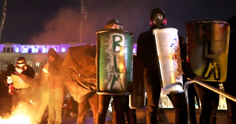 Black Lives Matter protesters hold shields during a protest in Washington, D.C., on Nov. 14, 2020.