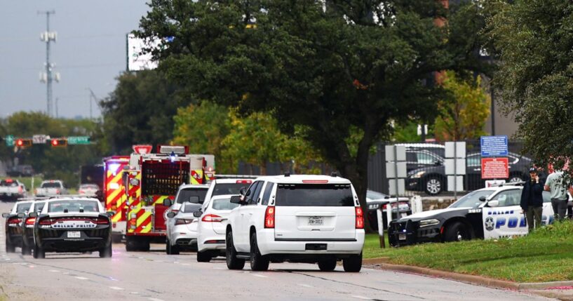 Law enforcement and emergency personnel respond near the scene of a shooting at a U.S. Immigration and Customs Enforcement detention facility in Dallas, Texas, on Sept. 24, 2025.