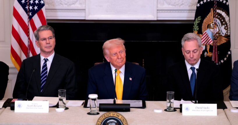 President Donald Trump speaks alongside Treasury Secretary Scott Bessent and White House Crypto Czar David Sacks at the White House Digital Assets Summit on March 7, 2025, in Washington, D.C.