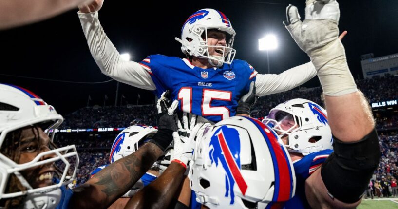 Matt Prater, center, of the Buffalo Bills celebrates with his teammates after kicking the game winning field goal following an NFL football game against the Baltimore Ravens in Orchard Park, New York, on Sunday.