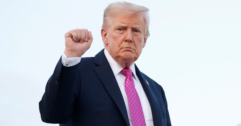 President Donald Trump boards Air Force One at Morristown Airport in Morristown, New Jersey, on Sunday.