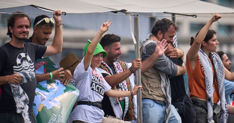 Greta Thunberg, third from left, waves from a boat taking part in a civilian flotilla bound for Gaza and leaving from Barcelona, Spain, on Aug. 31.