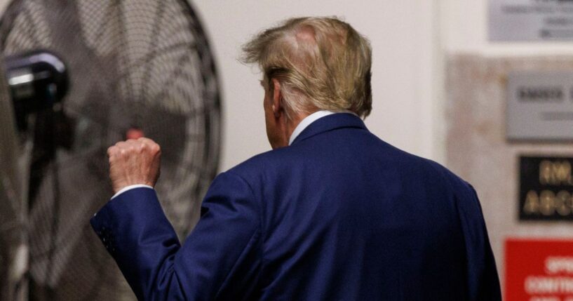 President Donald Trump holds up a fist in New York City on May 7, 2024.