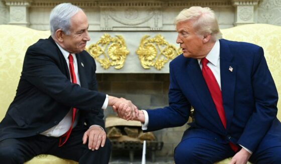 Israeli Prime Minister Benjamin Netanyahu, left, and President Donald Trump, right, shake hands during a meeting in the Oval Office of the White House in Washington, D.C., on April 7.