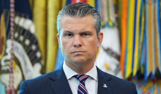 Secretary of Defense Pete Hegseth listens as President Donald Trump holds an executive order signing ceremony in the Oval Office of the White House in Washington, D.C., on Aug. 25.