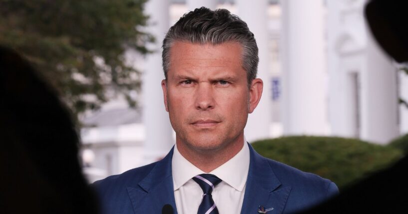 Secretary of Defense Pete Hegseth answers questions during a television interview outside the White House in Washington, D.C., on Aug. 7.
