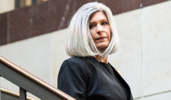 GOP Sen. Joni Ernst of Iowa makes her way to a briefing for members of the Senate Armed Services Committee at the U.S. Capitol in a file photo from July 29.