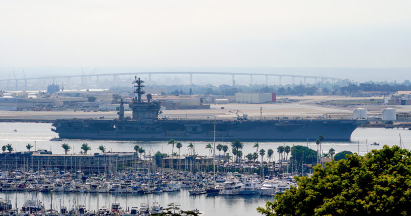 The USS Nimitz departs San Diego Bay at Mission Beach, in San Diego, California, on Aug. 19, 2023.