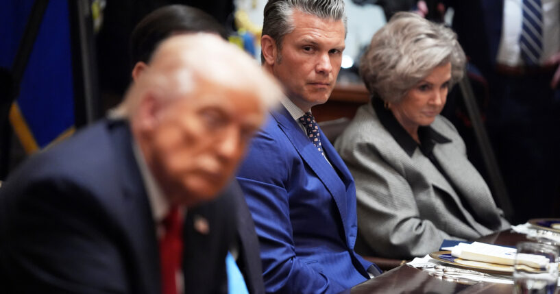 Defense Secretary Pete Hegseth listens as he and White House Chief of Staff Susie Wiles, right, listen during a meeting Monday with President Donald Trump, in foreground left, and Australian Prime Minister Anthony Albanese at the White House in Washington, D.C.