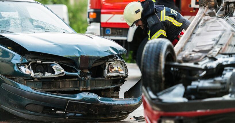 Firefighters at a car accident scene.