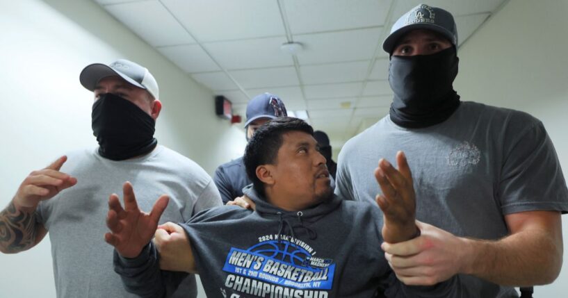 A man is detained by ICE agents after leaving a court hearing in immigration court at the Jacob K. Javitz Federal Building in New York City on Aug. 26.