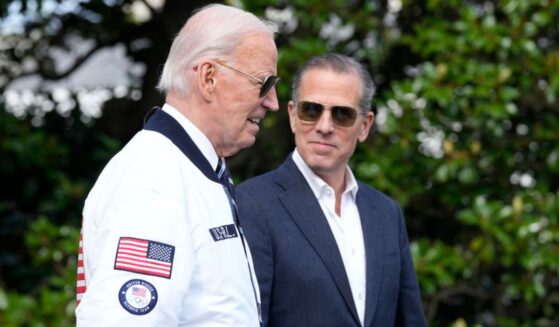 Then-President Joe Biden, left, and Hunter Biden. right, walk toward Marine One on the South Lawn of the White House in Washington, D.C., on July 26, 2024.