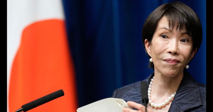 Japanese Prime Minister Sanae Takaichi listens to a journalist during a news conference in Tokyo on Oct. 21, 2025.