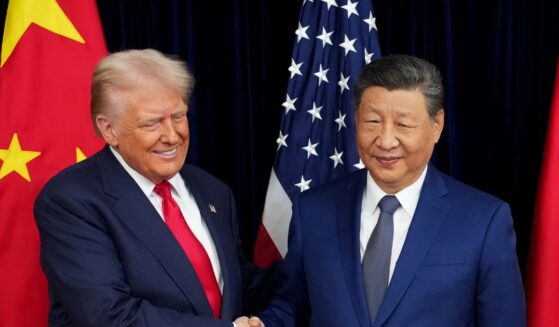 President Donald Trump and Chinese President Xi Jinping shake hands at Gimhae Air Base in Busan, South Korea on Oct. 30, 2025.