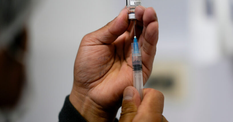 A health care worker prepares a shot of the Pfizer COVID-19 vaccine in La Paz, Bolivia, in a file photo taken Jan. 7.