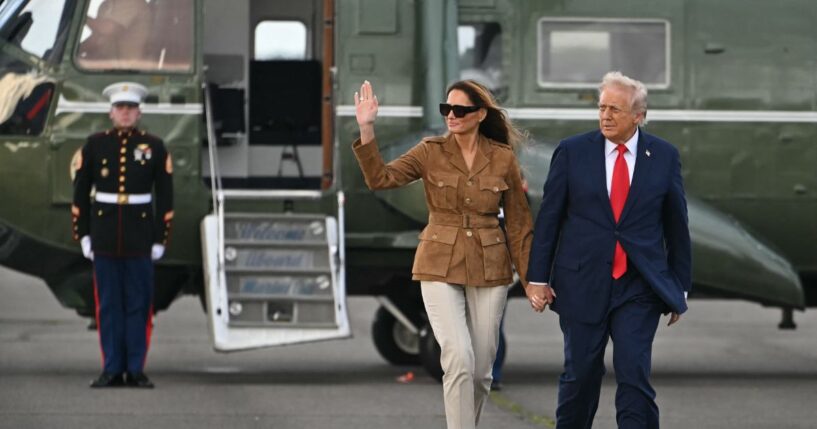 President Donald Trump and First Lady Melania Trump walk across the tarmac from the Marine One helicopter toward Air Force One at Stansted Airport, in Stansted, north of London, on Sept. 18, 2025.