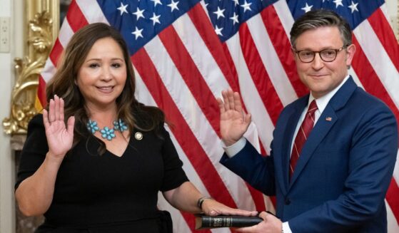 Rep. Adelita Grijalva, a Democrat from Arizona, re-enacts her swearing-in by Speaker of the House Mike Johnson, a Republican from Louisiana, at the U.S. Capitol in Washington, D.C., on Nov. 12, 2025.