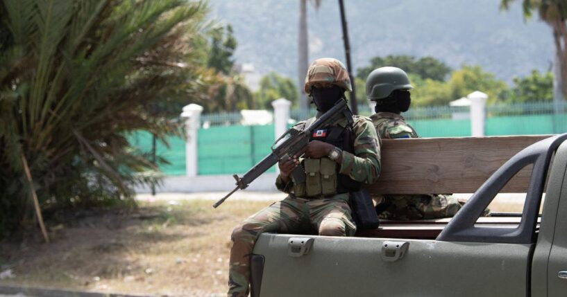 Members of the Haitian armed forces patrol the city center near the National Palace in Port-au-Prince on Oct. 1, 2025.