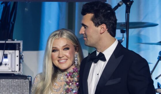 Charlie Kirk, right, is seen with his wife Erika Kirk on stage during the Turning Point USA Inaugural-Eve Ball in Washington, D.C., on Jan. 19.