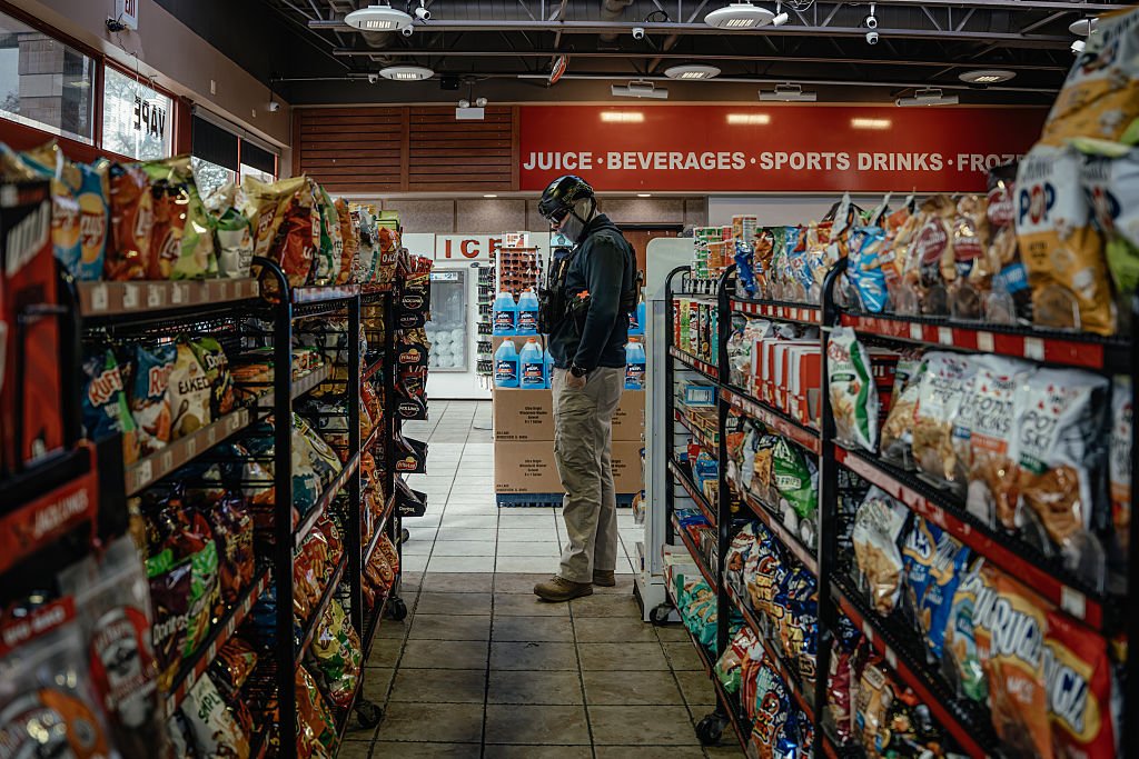 A federal officer shops for snacks