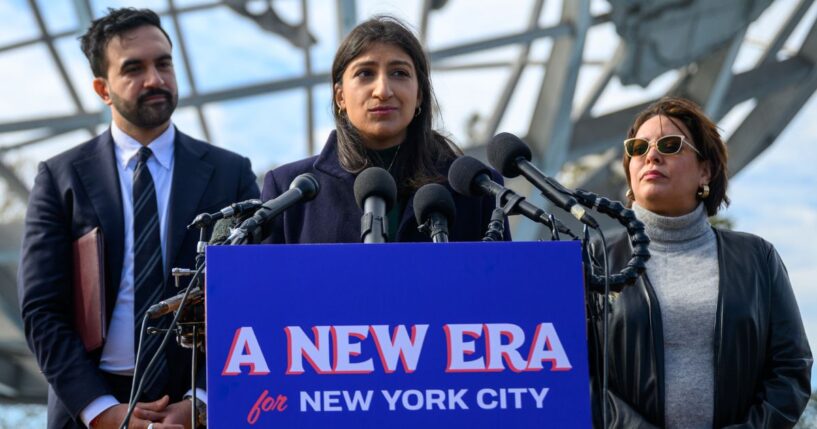 Lina Khan, center, speaks during a news conference Wednesday in the Queens borough of New York City. Mayor-elect Zohran Mamdani, left, named Khan co-chair of his transition team.