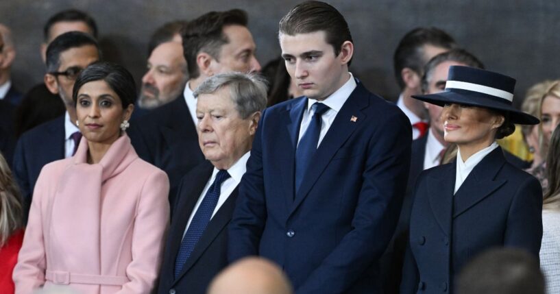 Barron Trump and Melania Trump look on during the inauguration ceremony in the US Capitol Rotunda in Washington, DC on Jan. 20, 2025.