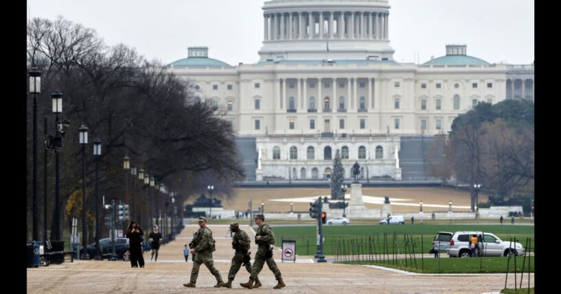 National Guard troops patrol on the National Mall near the US Capitol on Nov. 26, 2025 in Washington, DC.