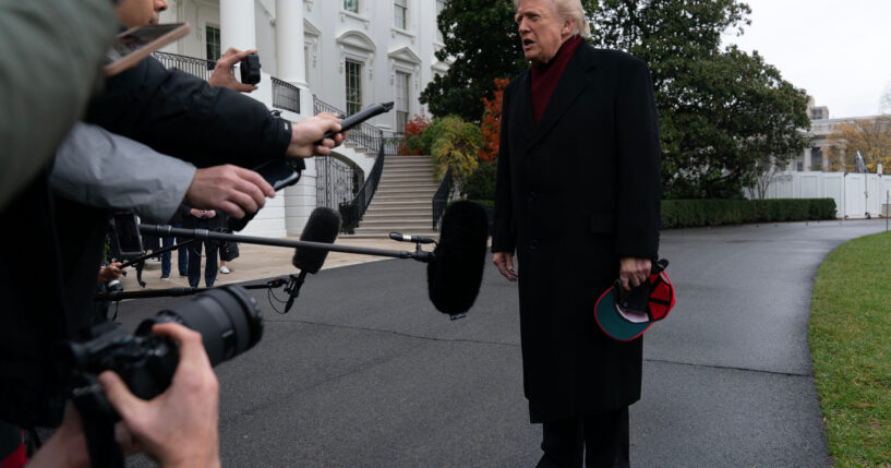 President Donald Trump talks to reporters as he departs from the South Lawn of the White House on Nov. 22, 2025, in Washington, D.C., en route to Joint Base Andrews.