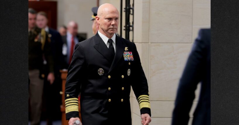 Navy Adm. Frank Bradley walks to a hold room between closed-door classified meetings with lawmakers on Capitol Hill on Thursday in Washington, DC. Members of the Senate and House Armed Services committees met with Bradley about the strikes on suspected drug boats out of Venezuela ordered by the Trump Administration.
