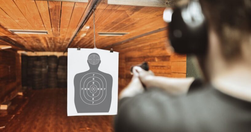 A file photo depicts a man practicing at a gun range. News reports lauded an Australian police officer for taking out two terrorists from 130 feet away during their shooting rampage Sunday at Sydney's Bondi Beach.