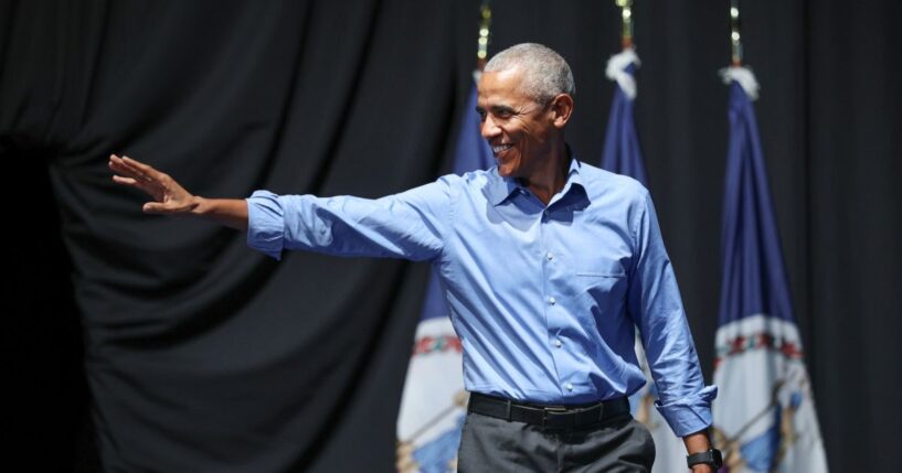 Former President Barack Obama waves to the crowd as he attends a campaign rally with Virginia Democratic gubernatorial candidate, former Rep. Abigail Spanberger, in the Chartway Arena on Nov. 1, 2025, in Norfolk, Virginia.