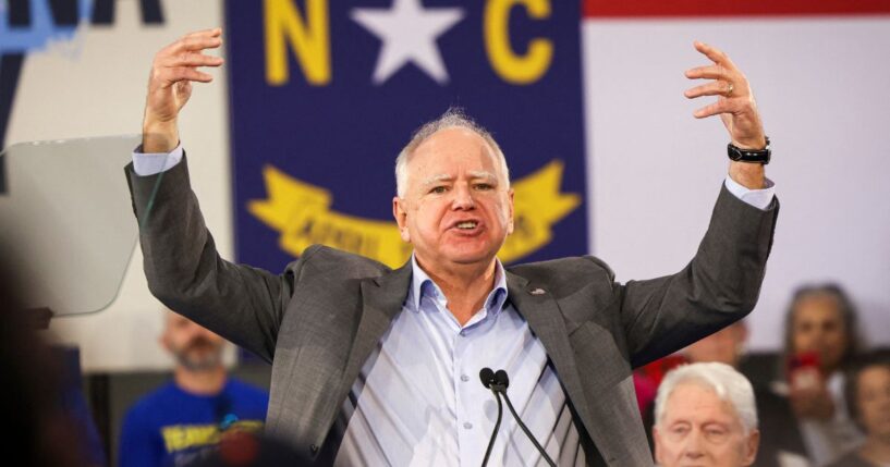 Minnesota Gov. Tim Walz gestures as he speaks during a Get-Out-The-Vote rally with former President Bill Clinton for Vice President Kamala Harris on the first day of North Carolina early voting in Durham, North Carolina, on Oct. 17, 2024.