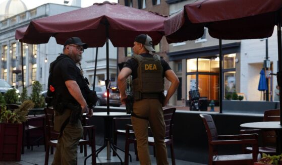 Drug Enforcement Administration personnel patrol M Street in Georgetown on Aug. 13, 2025, in Washington, D.C.