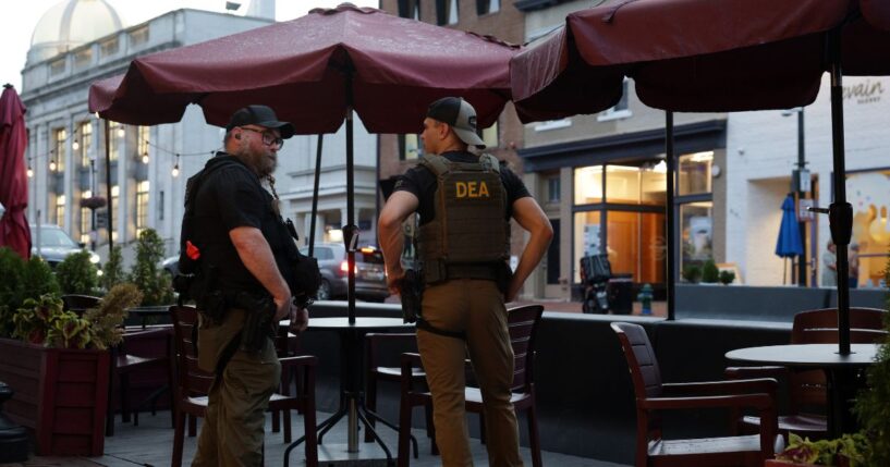 Drug Enforcement Administration personnel patrol M Street in Georgetown on Aug. 13, 2025, in Washington, D.C.
