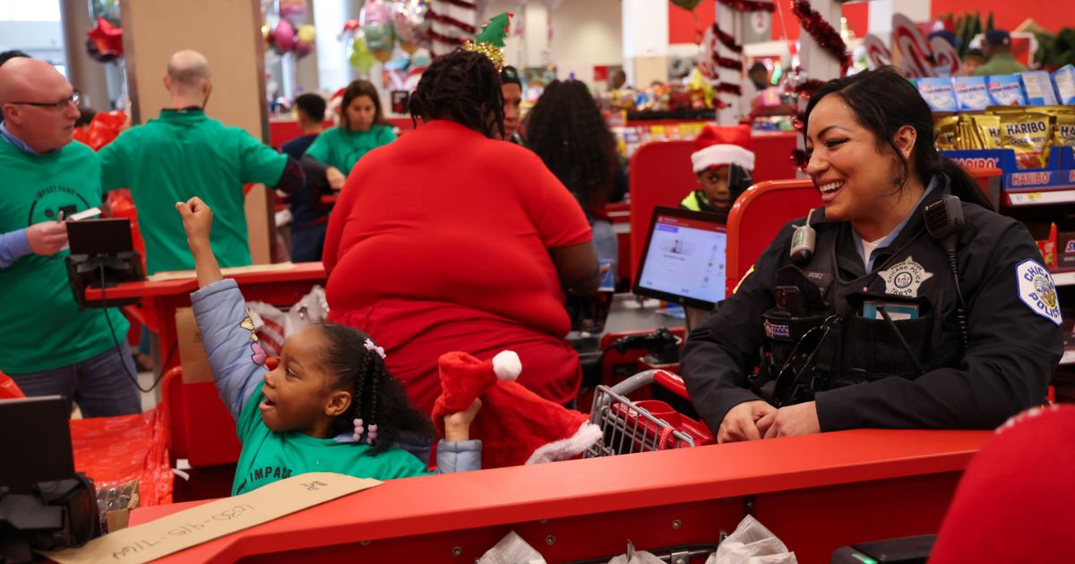 'Shop With a Cop' Sends Less Fortunate Kids on Mini Christmas Shopping Sprees With New Police Pals