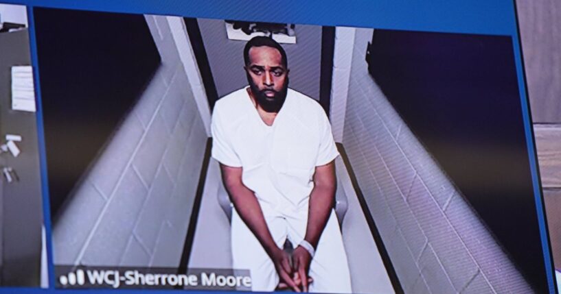 Fired Michigan football coach Sherrone Moore appears via video in court on Dec. 12, 2025, in Ann Arbor, Michigan.