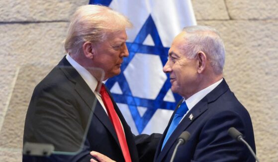 President Donald Trump speaks with Israeli Prime Minister Benjamin Netanyahu at the Israeli parliament, the Knesset, in Jerusalem on Oct. 13, 2025.