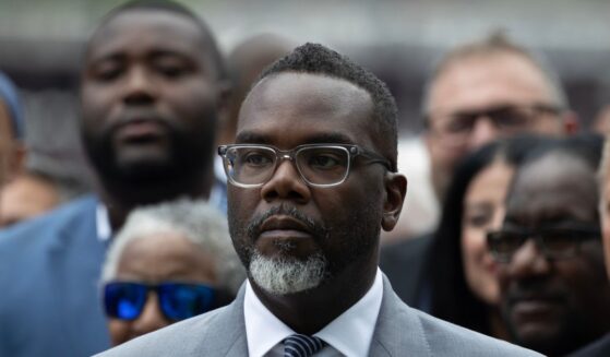 Chicago Mayor Brandon Johnson listens as Illinois Gov. J.B. Pritzker speaks at a news conference to address President Donald Trump's plan to send National Guard troops into the city on Aug. 25, 2025, in Chicago, Illinois.