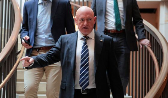 Sen. Mark Kelly arrives for a closed door meeting on Capitol Hill on Dec. 16, 2025, in Washington, D.C.