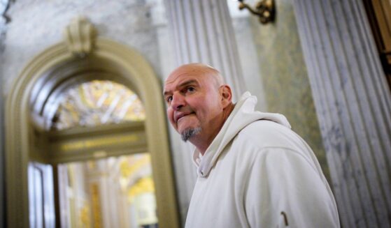 Sen. John Fetterman, one of eight Democrats to say he will vote with Republicans to open the government, arrives for votes on Nov. 10, 2025, on Capitol Hill in Washington, D.C.