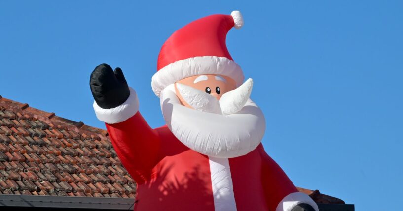 A large air inflatable Santa Claus Christmas outdoor decoration.