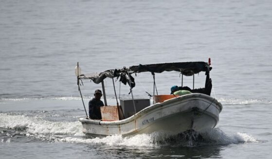 Fishermen sail on a boat near Caraballeda, La Guaira State, Venezuela, on Sept. 24, 2025.