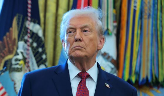 President Donald Trump listens during a ceremony for the presentation of the Mexican Border Defense Medal in the Oval Office of the White House on Dec. 15, 2025, in Washington, D.C.