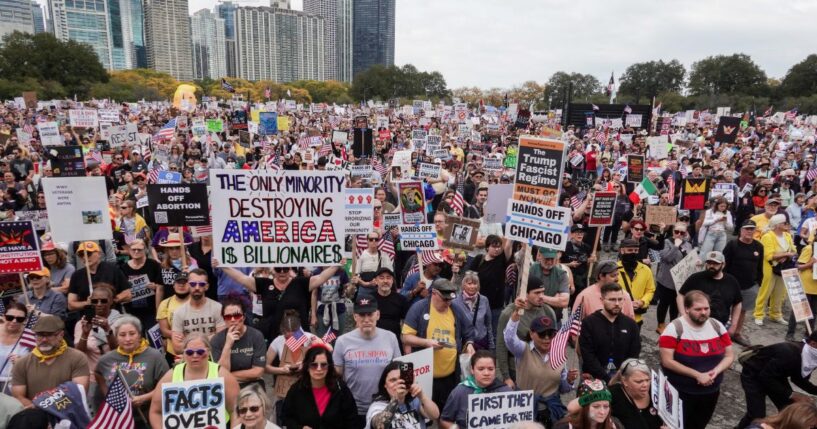 Protestors march in the second "No Kings" protest on Oct. 18, 2025, in Chicago, Illinois.